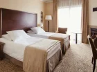 Wygodne, klasycznie urządzone pokoje Standard zapewniają komfort wypoczynku
