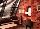 Pokój executive może zdobić przeszklony dach lub stylowe ceglane ściany