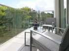 Apartamenty posiadają balkony z widokiem na nadmorski park