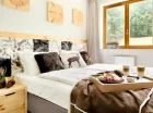 W apartamentach Lux znajduje się oddzielna sypialnia z łożem