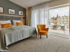 Hotel dysponuje apartamentami z dużymi tarasami i widokiem na Wawel