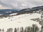 Obiekt jest położony 800 metrów od skoczni narciarskiej im. Adama Małysza