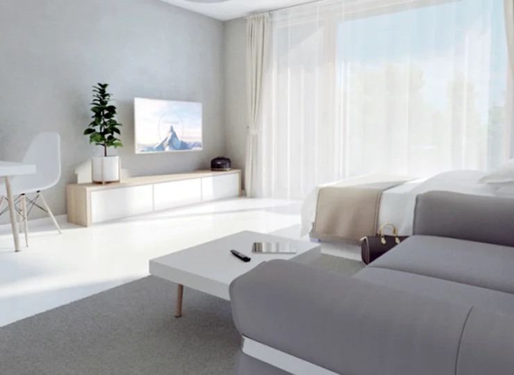 Jest tu łóżko, sofa, aneks kuchenny, stół, łazienka, balkon lub taras