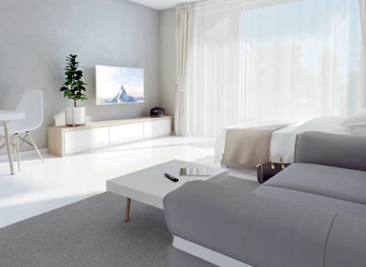 Jest tu łóżko, sofa, aneks kuchenny, stolik, balkon i łazienka