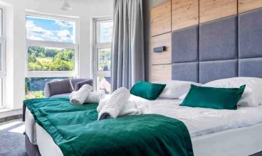 Apartamenty Anmago & Spa położone w Krynicy, w dzielnicy Słotwiny