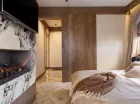 W sypialni Apartamentu Szpiglasowy Wierch jest kominek