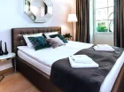 Sypialnia apartamentu 2+2 z sauną i tarasem