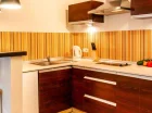 Każdy apartament ma wyposażony aneks kuchenny