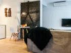 Każdy apartament (nawet studio) ma część dzienną z aneksem kuchennym