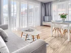 Komfortowy i przestronny pokój dzienny apartamentu comfort z rozkładaną sofą