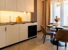 W każdym apartamencie jest pokój dzienny z aneksem kuchennym