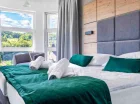 Apartamenty Anmago & Spa położone w Krynicy, w dzielnicy Słotwiny